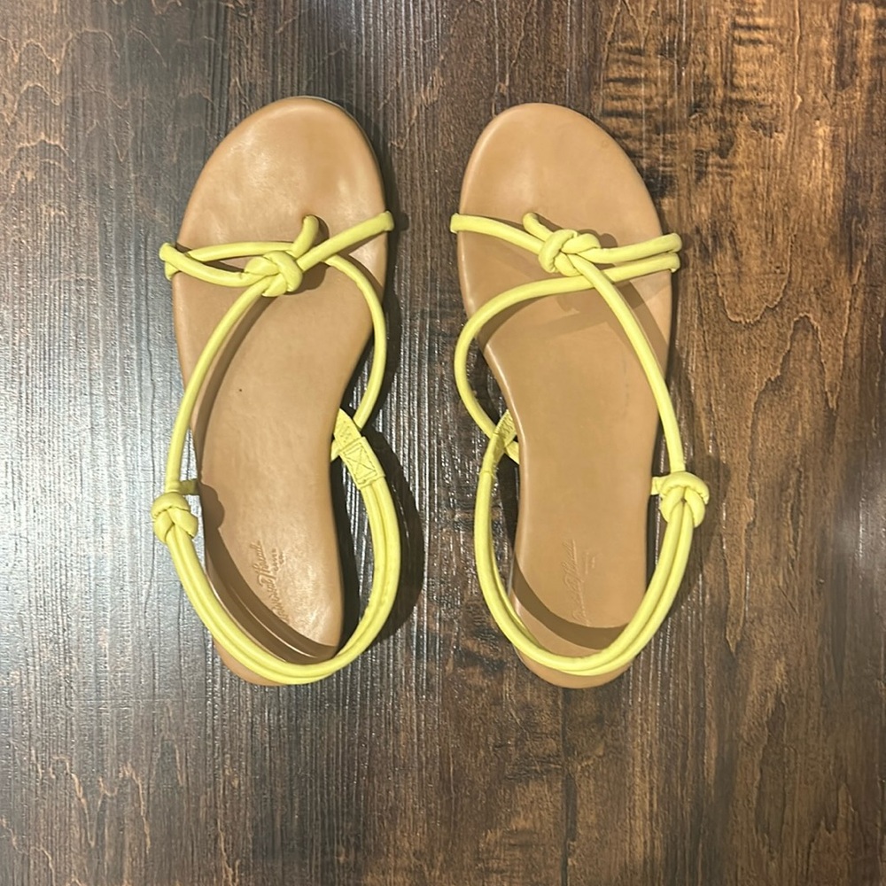 Yellow knott design sandals.